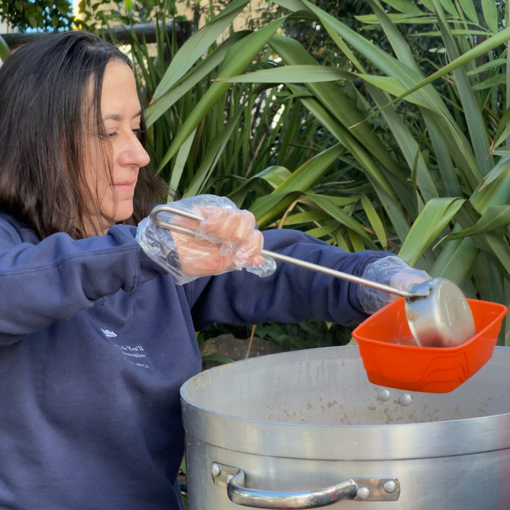 Linda Rock, former President of Bank of Denver, volunteering at the community soup kitchen in Franschhoek.