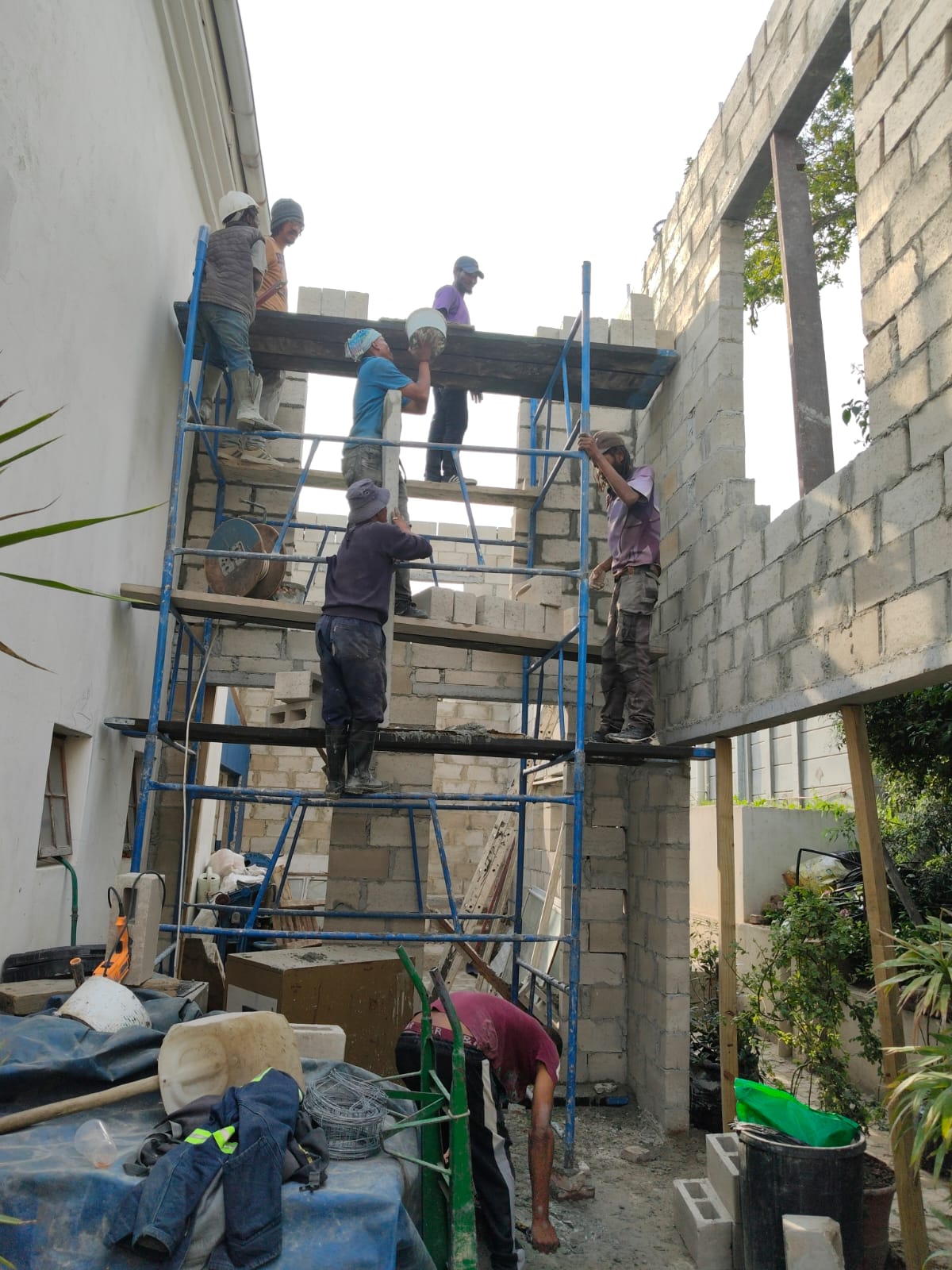 Team working together on the scaffolding
